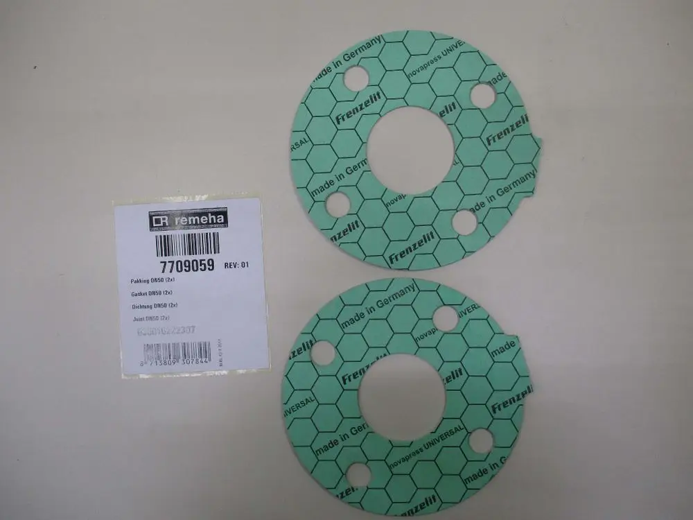 Zwei runde Dichtungen aus grünem Material mit hexagonalem Muster, gekennzeichnet mit "Frenzelli" und "Made in Germany", neben einem Etikett von Remeha.